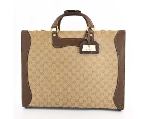 Gucci, a vintage monogram briefcase, featuring brown leather trim, dual looping top handles, a detachable leather ID tag, and