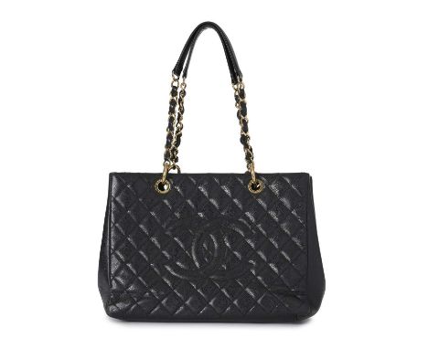 Chanel, a Grand Shopping Tote, crafted from grained black caviar leather with maker's classic diamond quilting and large embr