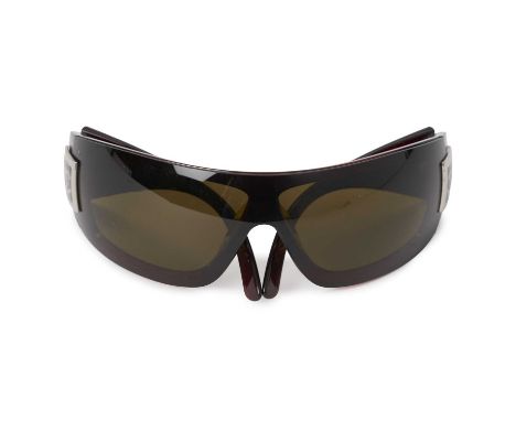 Chanel, a pair of Rimless Wrap CC sunglasses, featuring dark tinted lenses and the maker's signature CC logo on either side t