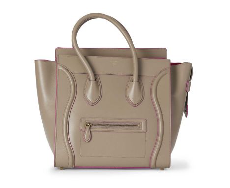 Celine, a Mini Luggage tote, featuring a grey leather exterior with pink trim and interior lining, expandable leather side wi