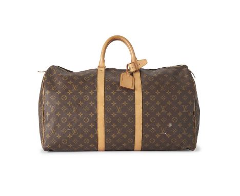 Louis Vuitton, a monogram Keepall 55 luggage bag, featuring the maker's classic monogram coated canvas exterior and tan leath
