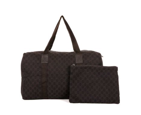 Gucci, a collapsible GG duffle bag and matching pouch, crafted from dark brown monogrammed canvas, featuring brown nylon hand