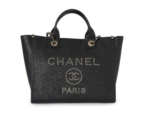 Chanel, a Deauville handbag, crafted from black caviar leather, featuring the maker's silver-tone studded logo to the front, 