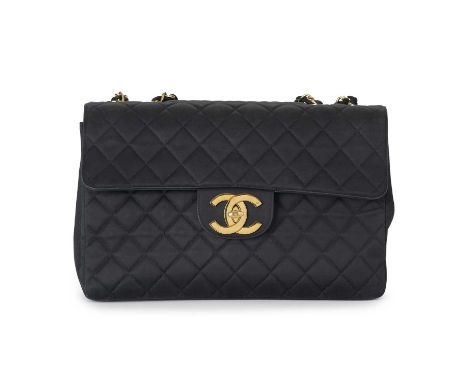 Chanel, a vintage Maxi Single Flap handbag, designed with a diamond quilted black textile exterior, with 24k gold-plated hard