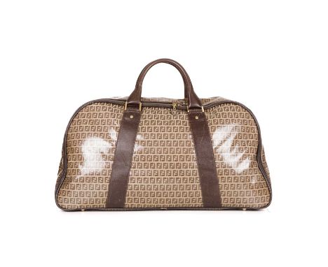 Fendi, a patent Zucca holdall, crafted from the maker's monogram coated canvas exterior, with smooth brown leather trim, dual