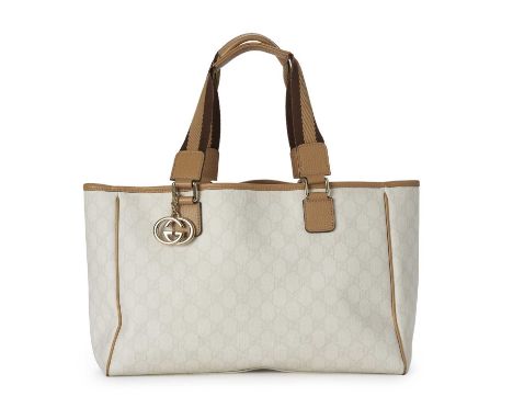 Gucci, a white GG Supreme tote, crafted from the maker's white monogram coated canvas exterior, with tan leather trim, a rear