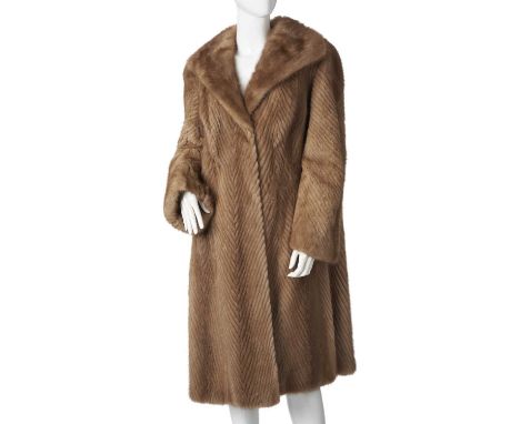 Sovereign Furs, a chevron patterned pastel mink coat, designed with a lapel collar, hook and eye clip fastenings, two outer p