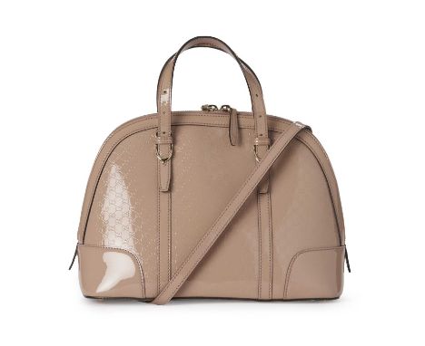 Gucci, a Microguccissima Dome bag, designed with a micro GG embossed patent leather exterior in nude pink, with dual slim lea