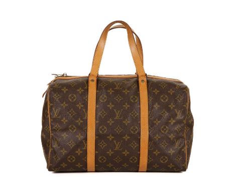 Louis Vuitton, a Sac Souple 35 handbag, featuring the maker's monogram coated canvas exterior with natural tan leather piping
