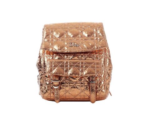 Christian Dior, a small Cannage Stardust backpack, featuring a metallic rose-gold crinkled calfskin leather exterior with sig