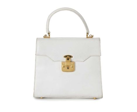 Gucci, a vintage Lady Lock handbag, designed with a structured shape, featuring a smooth white leather exterior, polished gol