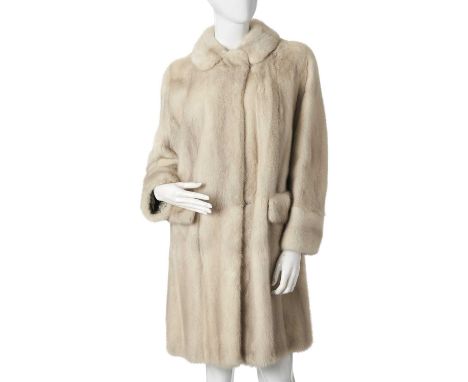 A knee-length azurene mink coat, designed with a notched lapel collar, hook and eye fastenings, rear half belt, two front pat