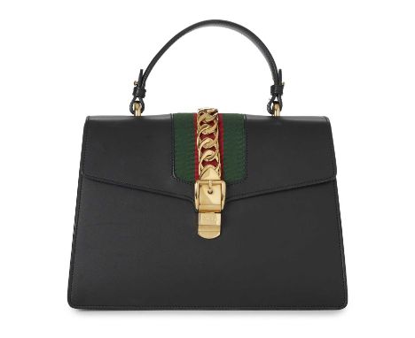 Gucci, a large black Sylvie handbag, designed with a structured shape, featuring a smooth black leather exterior, with the ma