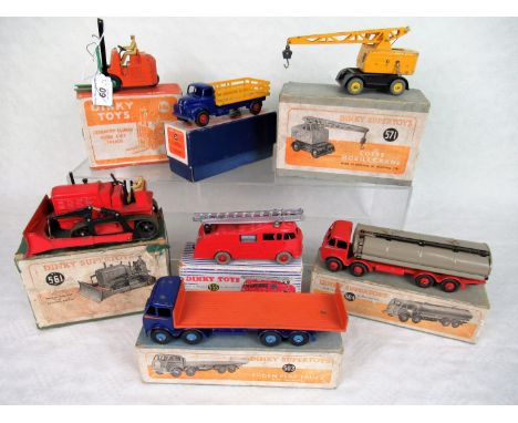 Seven boxed mid-20th century Dinky die-cast vehicles, to include: a (561) Blaw Knox Bulldozer, a (571) Coles Mobile Crane, a 