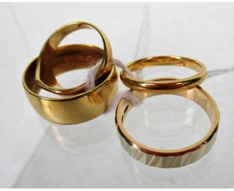 Four gold rings to include two 22ct gold and two 18ct (one unmarked) examples. Condition Report: 22ct - 8.2g / 18ct - 3.8g / 