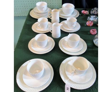 A Royal Albert part-tea service, comprising: six trios, two milk jugs, sugar bowls and other items, having a ribbed swirl des