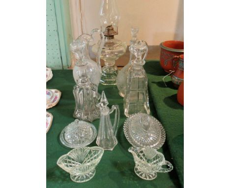 A mixed quantity of 19th century and later glassware, to include: decanters, a clear glass oil lamp, covered bowls and other 