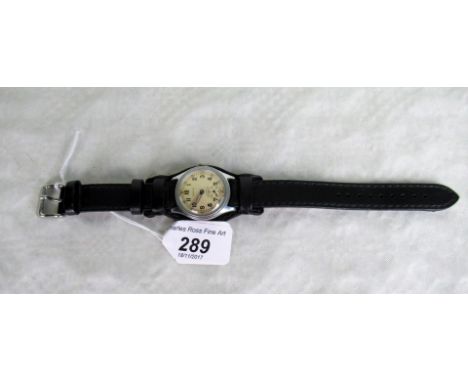 A mid-20th century Timor waterproof wristwatch, the reverse bearing a military arrow and 'ATP15399', the dial bearing Arabic 