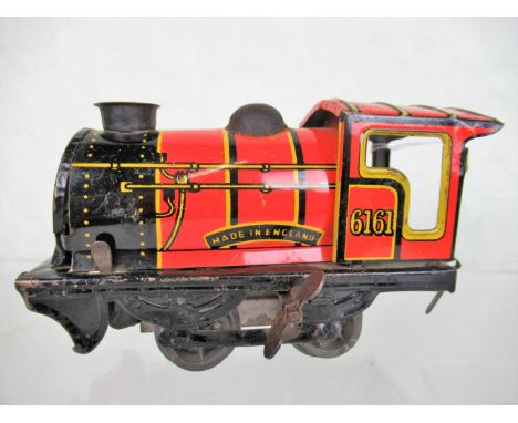 An early 20th century English tin plate clockwork steam engine, 13cm.