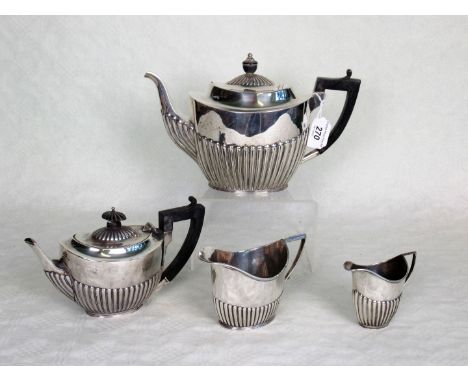 A late Victorian silver teapot and milk jug, Sheffield hallmarks 1890, together with a near matching small silver teapot and 