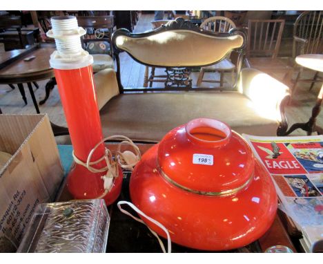 A mid-late 20th century Swedish orange glass table lamp, together with an orange glass ceiling shade, the lamp base 38cm.