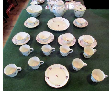 A 19th century porcelain part-tea service, comprising: seven cups & saucers, six tea bowls, large open sugar bowl, teapot and