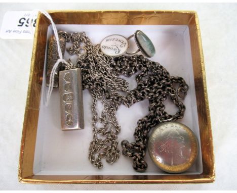 A mixed quantity of silver jewellery, to include: an ingot and chain, Victorian whistle and chain, butterfly wing ring and ot