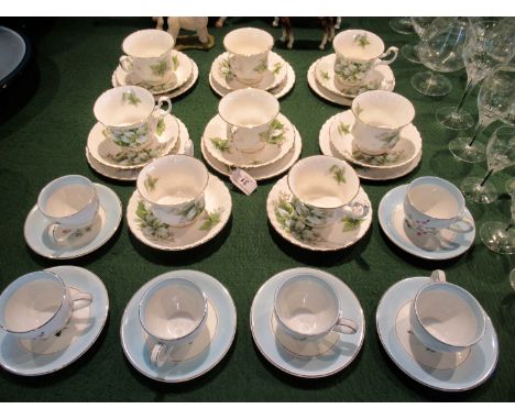 A set of six Burleigh Ware coffee cups & saucers, each having floral decoration within a blue band on an ivory ground, togeth