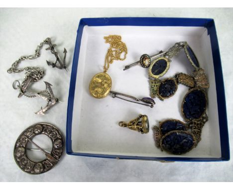 A mixed lot of jewellery, to include: a silver circular Celtic brooch, a yellow metal locket and chain, 19th century yellow m