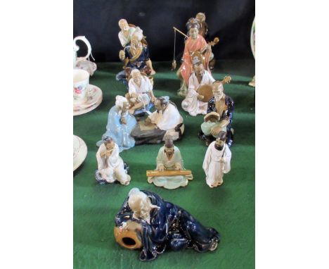 A collection of ten contemporary ceramic Oriental figures, to include: musicians, a fisherman and others.