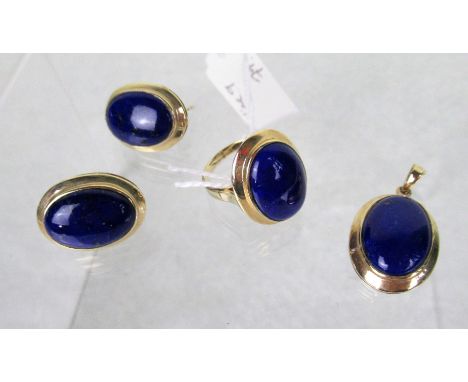 A 10ct gold dress ring, set with oval lapis lazuli stone, together with a pair of earrings and pendant en-suite.   Condition 