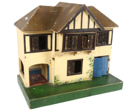 A Vintage hand-made wooden doll's house, spread over 2 levels, with some associated Vintage doll's house furniture and other 