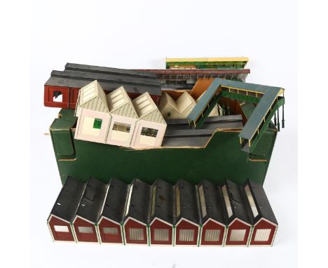 A quantity of Vintage model railway buildings, mostly plastic models including train platforms and other out-buildings

 