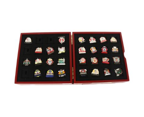 ARSENAL FC INTEREST - a Danbury Mint Victory pin collection, in associated display case, collection holds 32 pins in total of
