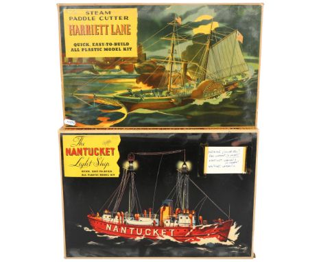 2 boxes of plastic model display kits relating to various ships, the kits inside the boxes appear unrelated to the boxes them