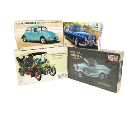 A Tamiya Jaguar Mk II saloon plastic model kit, a Hasegawa 1:24 scale Volkswagen Beetle Type I plastic model kit, a Gakken 1/