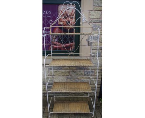 A wrought iron folding four shelf unit. 198cm high.