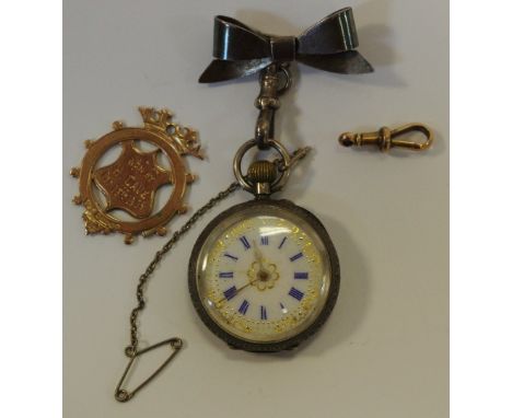 A 9ct gold shield fob; a 9ct gold lobster claw clasp (5.9g); a continental silver lady's fob watch, white enamel dial, blue R