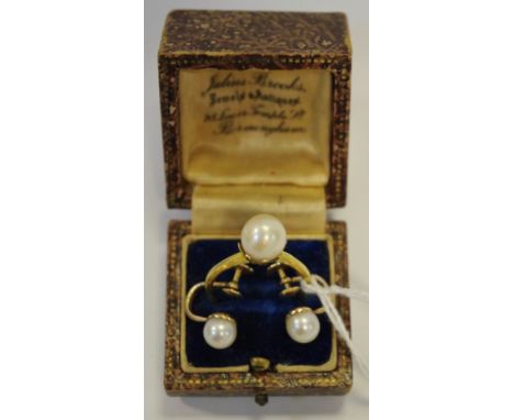 A continental gold pearl solitaire ring stamped Italy K18; a pair of 14ct gold open screw back pearl earrings 