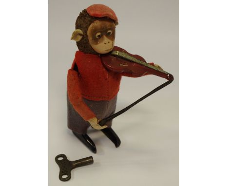 A Schuco clockwork violin playing monkey, with key c.1940s