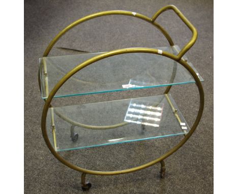 An Art Deco style brass tea trolley with glass shelving.