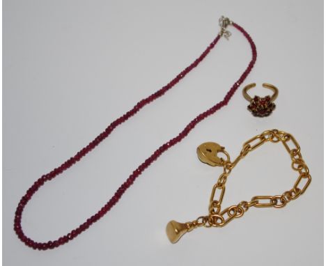 A gold plated Albert bracelet; a ruby necklace; a garnet ring