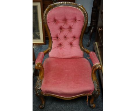 A Victorian spoon back button upholstered chair