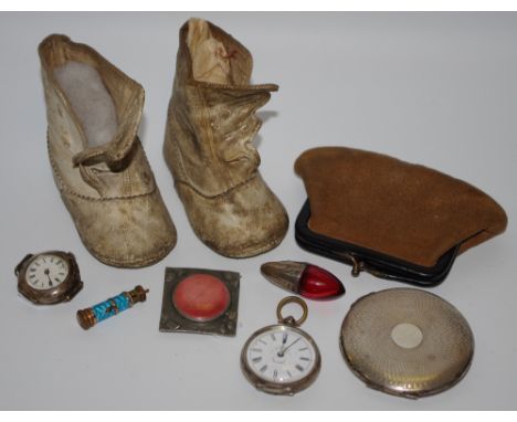 Bijouterie - a pair of 19th century baby shoes; an early 20th century silver compact, engine turned, vacant cartouche; an Art