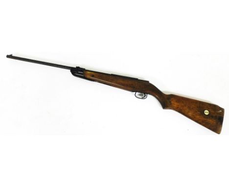 A vintage 22 air rifle, with metal mounts and wooden stock, 105cm wide. 