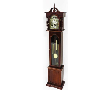 A Highlands granddaughter clock, in mahogany finish case, with arched 16cm dial, stencilled spandrels and Roman numeric chapt