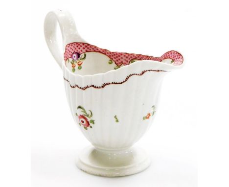 A late 18thC Newhall porcelain fluted cream jug, pattern number 173, with rose band decoration within scale borders, circa 17