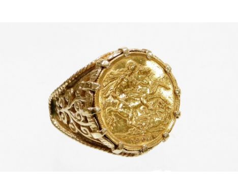 A 9ct gold Edward VII full gold sovereign ring, the sovereign dated 1904 in heavy scroll 9ct gold ring mount, ring size Z plu