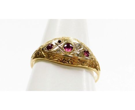 An 9ct gold Victorian style dress ring, the centre set with three garnets and four diamonds (one missing), the outer border w