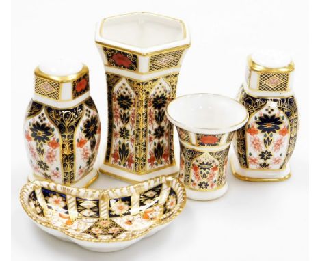 A collection of Royal Crown Derby porcelain Imari pattern items, to include salt and pepper shakers, 10cm high, a crescent sh